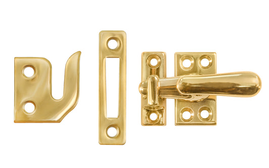 Classic & Traditional Solid Brass Casement Window Latch ~ Regular Size. 1-9/16" high x 7/8" wide latch turn base. Locks & tightens window frames or small doors. Reversible for right or left applications. Vintage-style casement window lock. Unlacquered Brass (will patina over time). Non-lacquered brass. Un-lacqeured brass.
