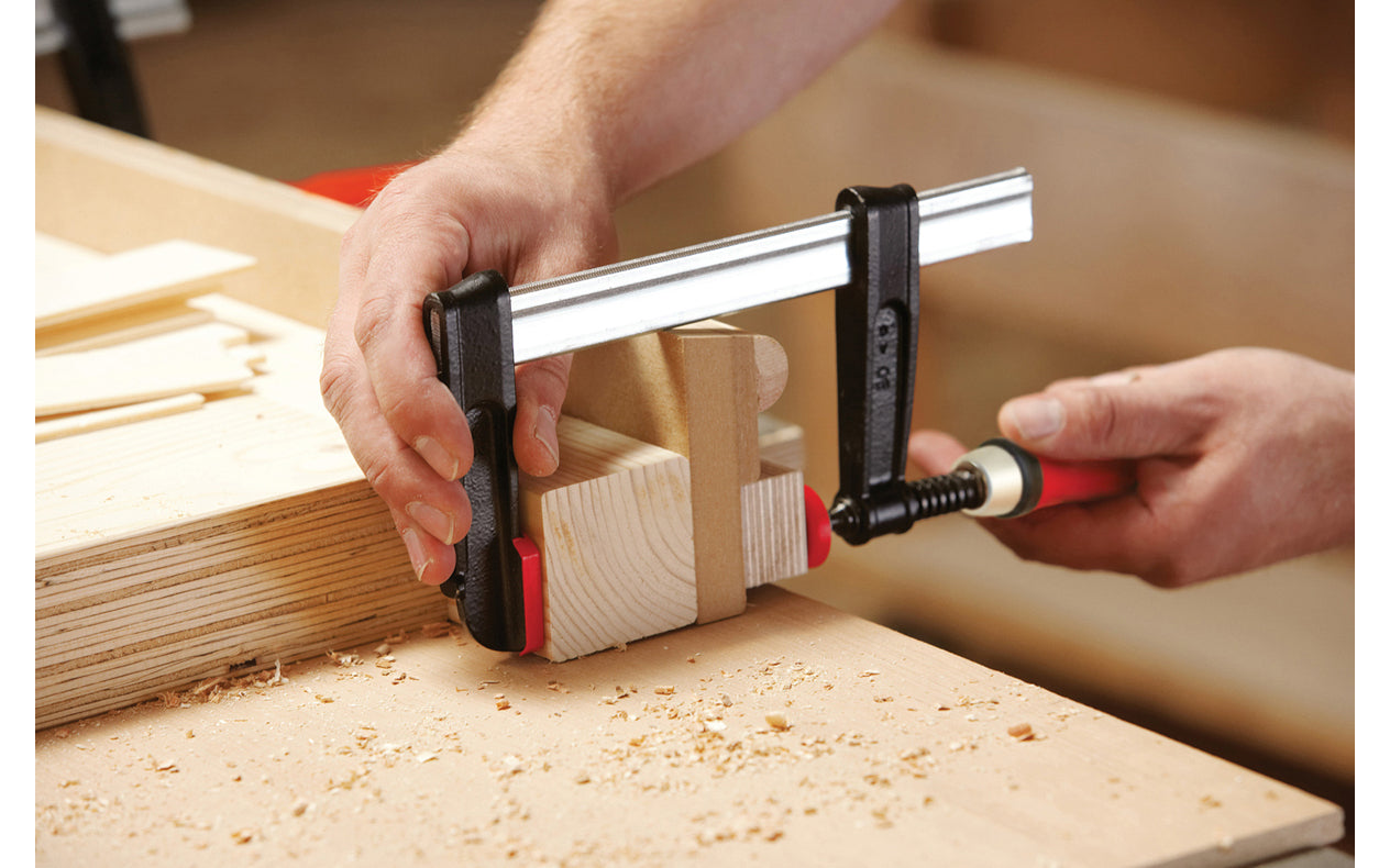 Bessey Light-Duty Steel Bar Clamps heads are made of malleable cast iron. The fixed jaw & sliding arm generates powerful & rigid clamping - acts against torsional forces - Wooden handles - 600 lbs. clamping pressure - Model No. TGJ2.512 - "TG series" Bessey Clamps 12" max opening - 2-1/2" throat depth - Made in Germany - 091162006023