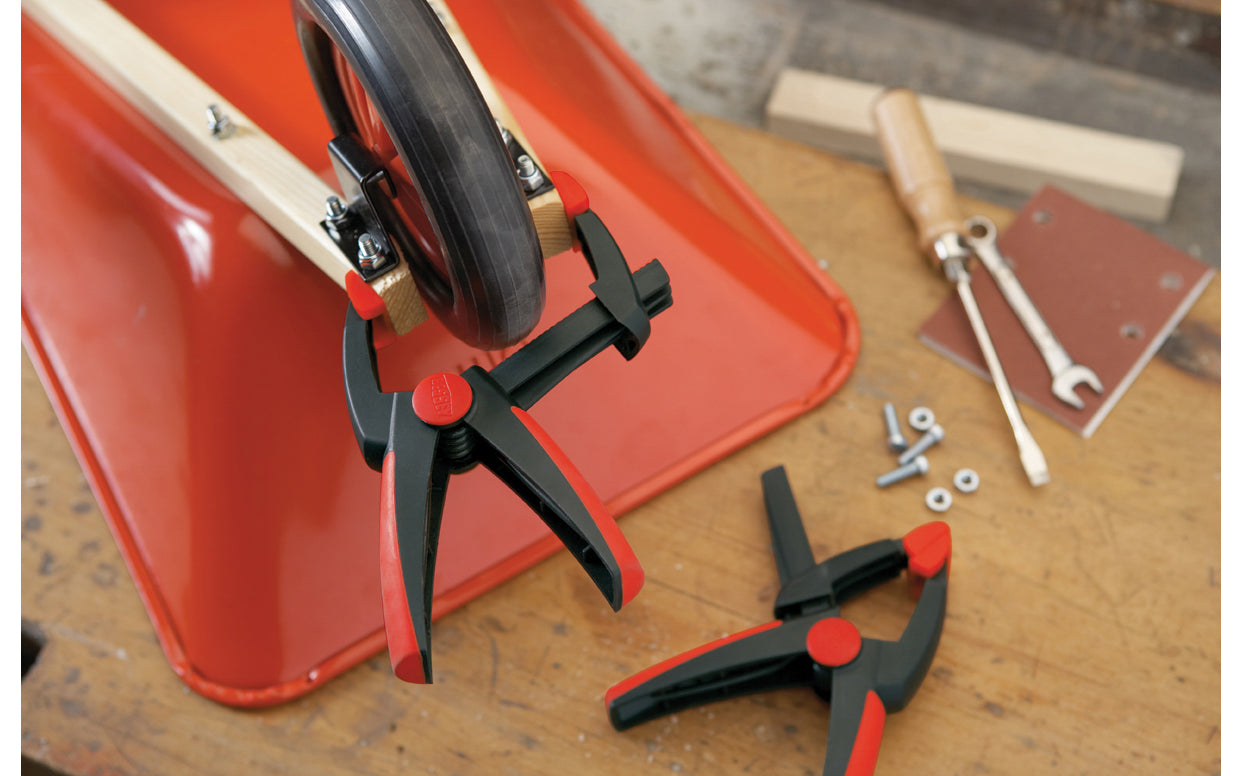 Bessey Clamps Model No. XV5-100 - These variable spring clamps from Bessey can clamp on items and have 4" max opening. 2" depth reach. They have soft-touch swivel pads that prevent marring of soft work & the handles remain in constant easy-to-grip position at all openings. Soft & non-slip two component ergonomic handle