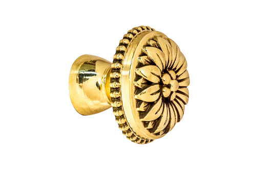 Traditional & classic "French Style" cabinet knob with an elegant flower design & beaded trim. Made of high quality solid brass, his knob has a weighty & durable feel. Great for cabinets, furniture & drawers. The knob is designed in the Late 19th Century style of hardware. Unlacquered brass (will patina over time). Available in 1-1/8" diameter knob & 1-1/2 diameter knob.