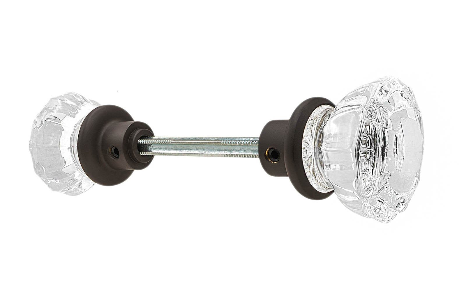 Pair of Classic Fluted Clear Glass Doorknobs with spindle. A high quality & genuine glass doorknob set with an attractive fluted design. The sparkling center point under glass amplifies reflected light to showcase beautiful facets. Solid brass base. Reproduction Glass Door Knobs. Traditional Fluted Glass Knobs. Polished Nickel Finish.