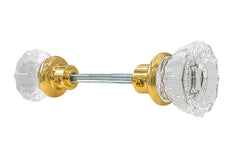Pair of Classic Fluted Clear Glass Doorknobs with spindle. A high quality & genuine glass doorknob set with an attractive fluted design. The sparkling center point under glass amplifies reflected light to showcase beautiful facets. Solid brass base. Reproduction Glass Door Knobs. Traditional Fluted Glass Knobs. Lacquered Brass Finish.