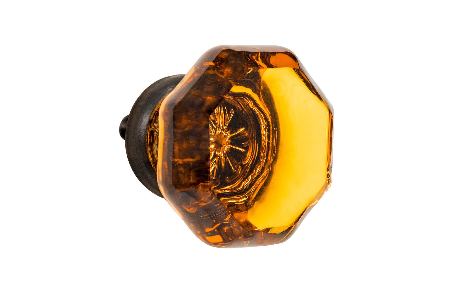 Elegant & classic octagonal cabinet glass knob with an attractive "Amber" color. The glass is carefully set into a handsome solid brass base with a threaded shank in the back. Oil rubbed bronze finish on solid brass base. Octagon shape knob. 1-1/4" Diameter Knob