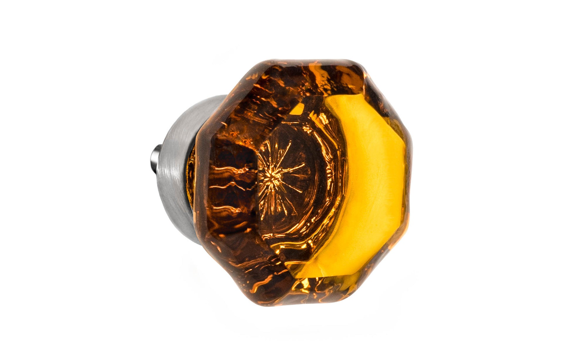 Elegant & classic octagonal cabinet glass knob with an attractive "Amber" color. The glass is carefully set into a handsome solid brass base with a threaded shank in the back. Brushed nickel finish on solid brass base. Octagon shape knob. 1-1/4" Diameter Knob