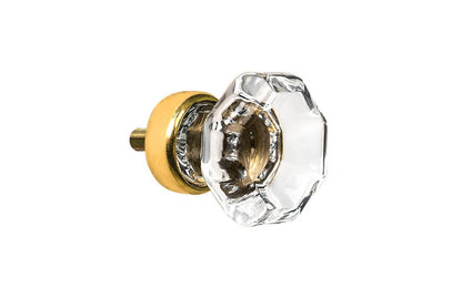 Elegant & classic octagonal cabinet glass knob with attractive genuine clear glass. The glass is carefully set into a handsome solid brass base with a threaded shank in the back. Unlacquered brass base - Will patina naturally over time. Octagon shape knob. 1" Diameter Knob 