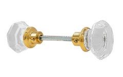 Pair of Classic Octagonal Clear Glass Doorknobs with spindle. A high quality & genuine glass doorknob set with an attractive octagon design. The sparkling center point under glass amplifies reflected light to showcase beautiful facets. Solid brass base. Reproduction Glass Door Knobs. Traditional Octagon Glass Knobs. Unlacquered brass (will patina naturally), Non-Lacquered Brass 