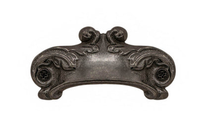 Rustic-looking & ornate cast iron bin pull with a nice scroll pattern detail. Made of cast iron material, this bin pull is thick with a good grip. This old-style bin pull is great for adding charm to your cabinets & drawers. Vintage-style finish with lacquer to resist rust. Scroll Pattern Bin Pull ~ 3-1/8" on Centers