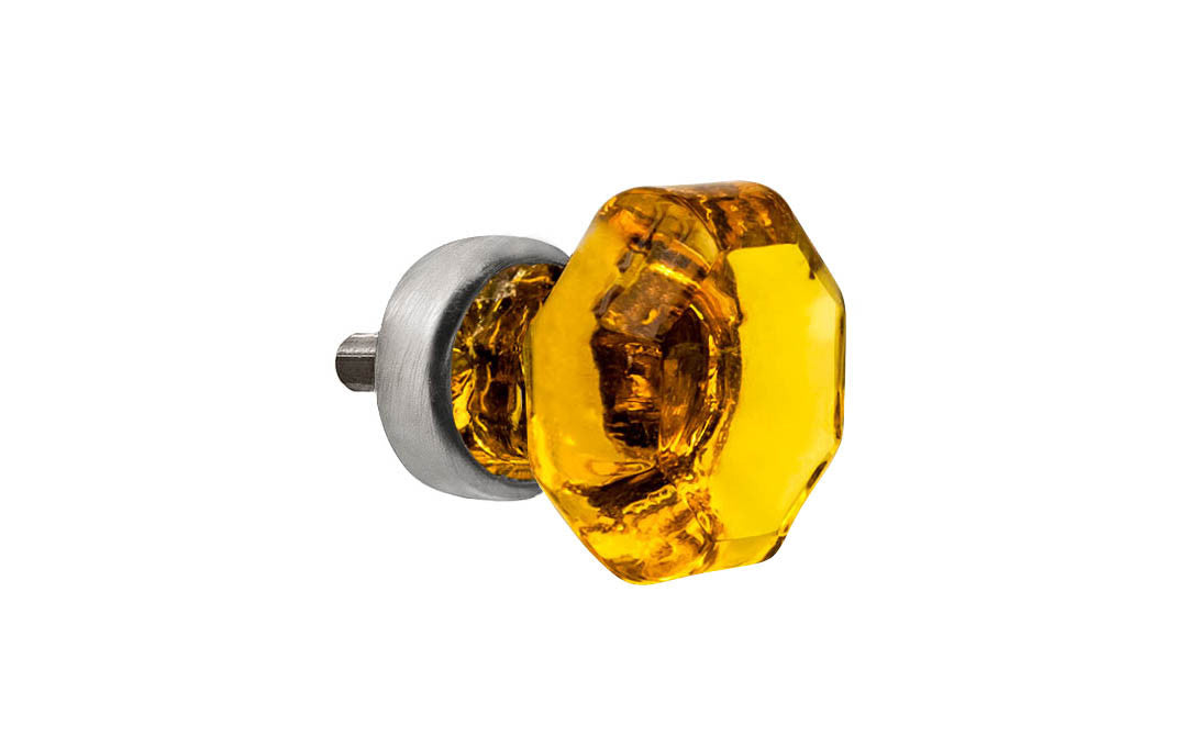 Elegant & classic octagonal cabinet glass knob with an attractive "Amber" color. The glass is carefully set into a handsome solid brass base with a threaded shank in the back. Brushed nickel finish on solid brass base. Octagon shape knob. 1" Diameter Knob