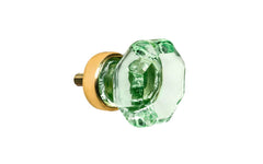 Elegant & classic octagonal cabinet glass knob with an attractive "Depression Green" color. The glass is carefully set into a handsome solid brass base with a threaded shank in the back. Unlacquered brass base - Will patina naturally over time. Octagon shape knob. 1" Diameter Knob 