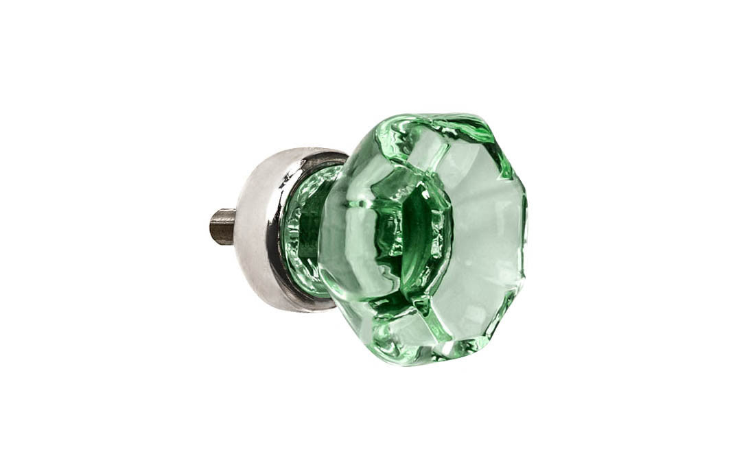Elegant & classic octagonal cabinet glass knob with an attractive "Depression Green" color. The glass is carefully set into a handsome solid brass base with a threaded shank in the back. Polished nickel finish on solid brass base. Octagon shape knob.  1" Diameter Knob 