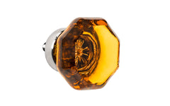 Elegant & classic octagonal cabinet glass knob with an attractive "Amber" color. The glass is carefully set into a handsome solid brass base with a threaded shank in the back. Polished nickel finish on solid brass base. Octagon shape knob. 1-1/4" Diameter Knob