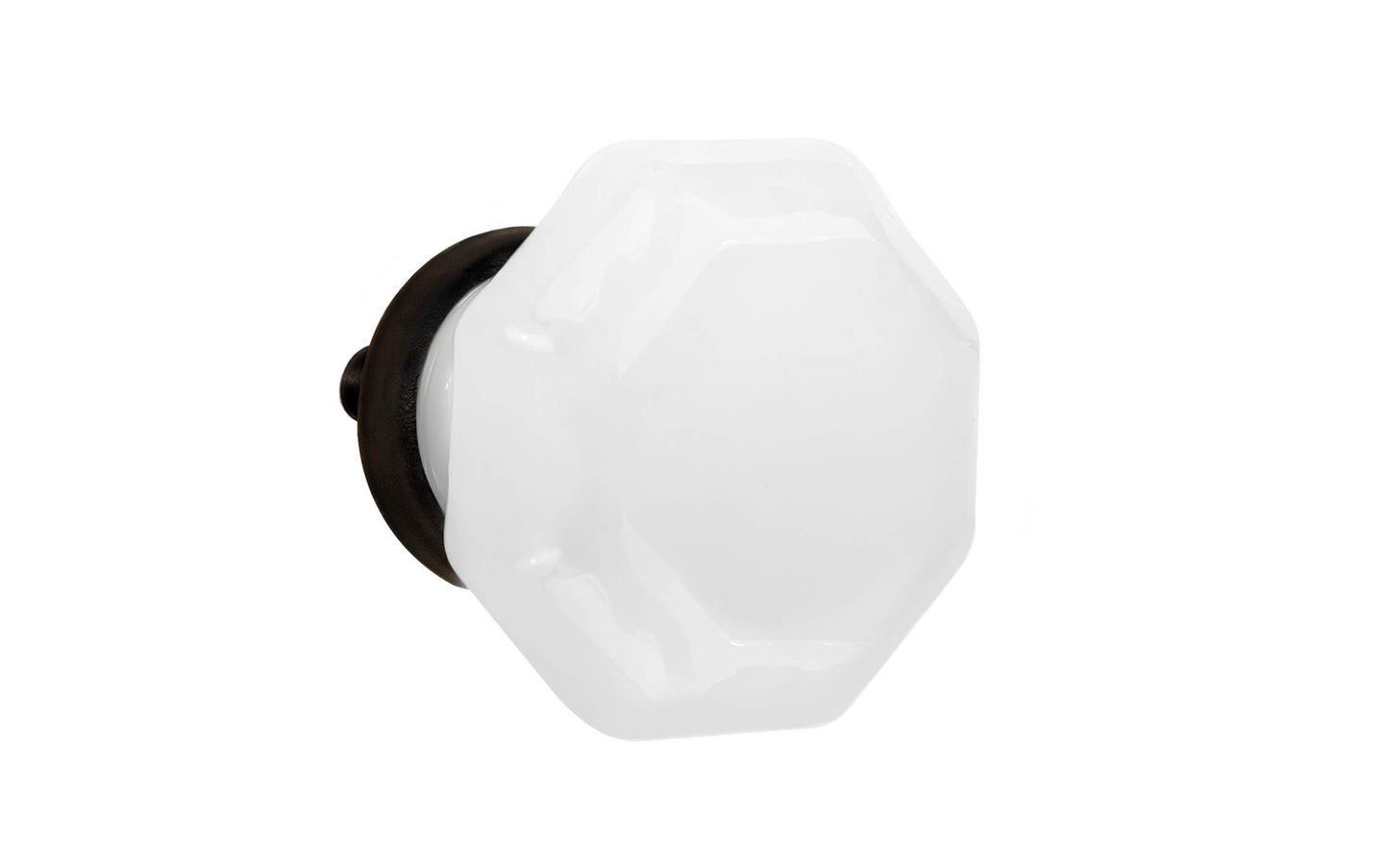 Elegant & classic octagonal cabinet glass knob with an attractive "Translucent White Opal" color. The glass is carefully set into a handsome solid brass base with a threaded shank in the back. Oil Rubbed Bronze finish on solid brass material. Octagon shape knob. 1-1/4" Diameter Knob 