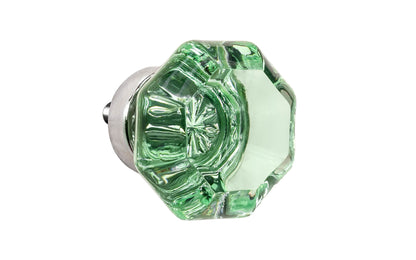 Elegant & classic octagonal cabinet glass knob with an attractive "Depression Green" color. The glass is carefully set into a handsome solid brass base with a threaded shank in the back. Polished nickel finish on solid brass base. Octagon shape knob.  1-1/4" Diameter Knob 